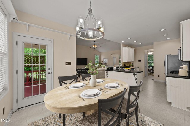 1604 Carnation Dr, Durham, NC 27703 - dining space with a chandelier, a ceiling fan, baseboards, light tile patterned flooring, and recessed lighting