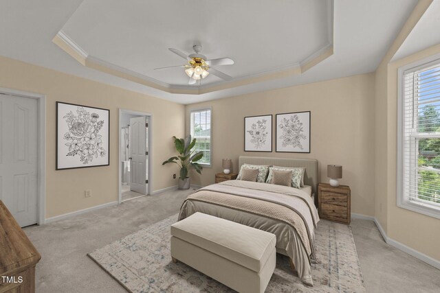 1604 Carnation Dr, Durham, NC 27703 - bedroom featuring a raised ceiling, multiple windows, and ornamental molding