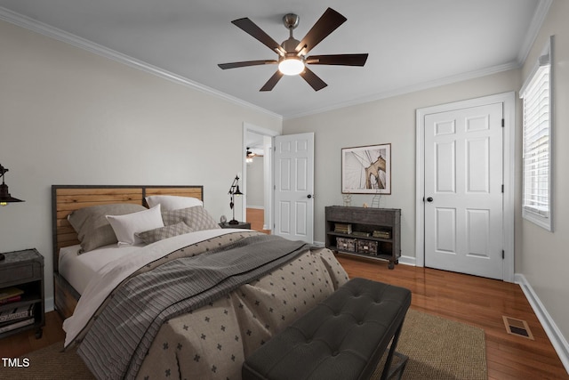 301 Williamson St, Burlington, NC 27215 - bedroom with wood finished floors, crown molding, and ceiling fan