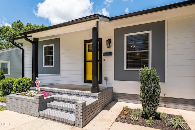 301 Williamson St, Burlington, NC 27215 - view of exterior entry featuring a porch