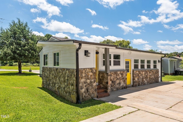 301 Williamson St, Burlington, NC 27215 - view of front of property with stone siding and a front lawn