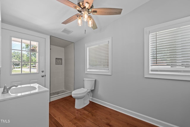 301 Williamson St, Burlington, NC 27215 - bathroom with a stall shower, vanity, wood finished floors, ceiling fan, and lofted ceiling