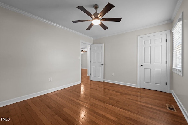 301 Williamson St, Burlington, NC 27215 - unfurnished bedroom featuring hardwood / wood-style flooring, crown molding, and a ceiling fan
