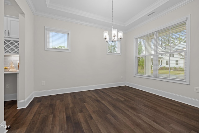 3053 Roy Ct, Apex, NC 27523 - unfurnished dining area with a chandelier, plenty of natural light, dark wood-style floors, and crown molding
