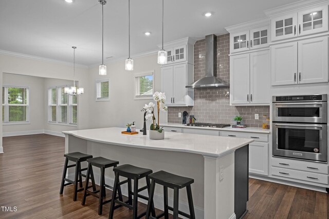 3053 Roy Ct, Apex, NC 27523 - kitchen featuring wall chimney range hood, stainless steel appliances, light countertops, dark wood-style floors, and backsplash