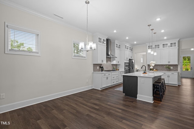 3053 Roy Ct, Apex, NC 27523 - kitchen with wall chimney range hood, a chandelier, light countertops, gas stovetop, and tasteful backsplash