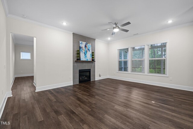 3053 Roy Ct, Apex, NC 27523 - unfurnished living room with a ceiling fan, crown molding, dark wood-type flooring, a fireplace, and recessed lighting