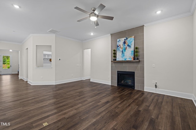 3053 Roy Ct, Apex, NC 27523 - unfurnished living room featuring ceiling fan, dark wood-style floors, a tile fireplace, crown molding, and recessed lighting