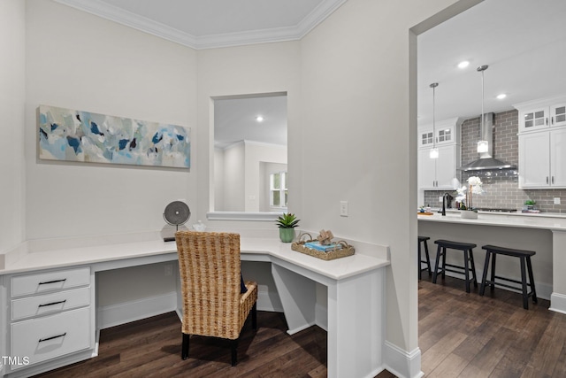 3053 Roy Ct, Apex, NC 27523 - home office featuring built in desk, crown molding, dark wood-type flooring, and recessed lighting