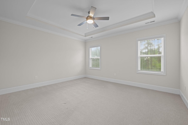 3053 Roy Ct, Apex, NC 27523 - spare room with a tray ceiling, healthy amount of natural light, ornamental molding, light colored carpet, and a ceiling fan
