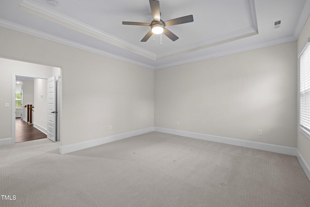 3053 Roy Ct, Apex, NC 27523 - unfurnished room with a raised ceiling, carpet, ceiling fan, and ornamental molding