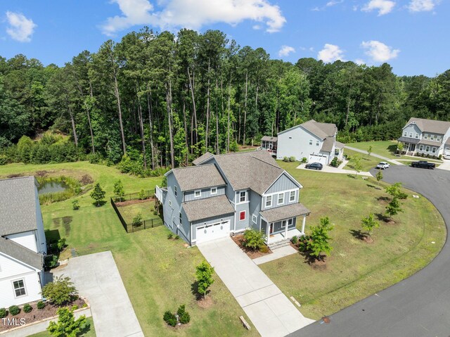 3053 Roy Ct, Apex, NC 27523 - aerial view of property and surrounding area featuring a heavily wooded area