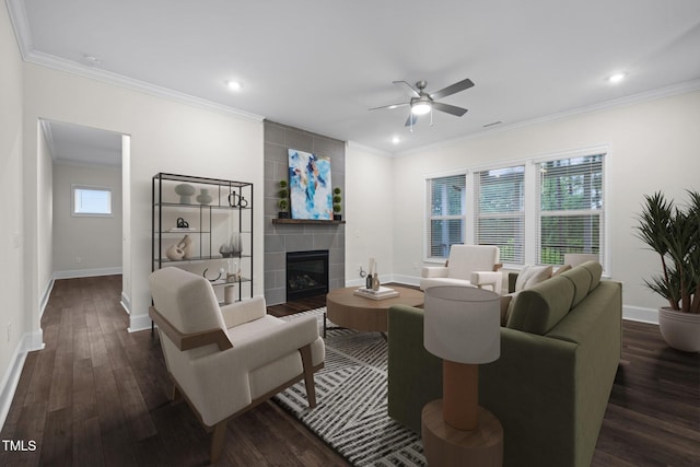 3053 Roy Ct, Apex, NC 27523 - living room featuring a ceiling fan, a tile fireplace, ornamental molding, dark wood-style flooring, and recessed lighting