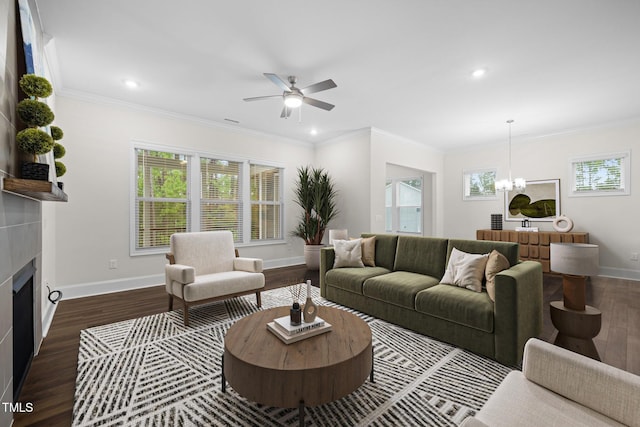 3053 Roy Ct, Apex, NC 27523 - living area with dark wood finished floors, plenty of natural light, a chandelier, a ceiling fan, and recessed lighting