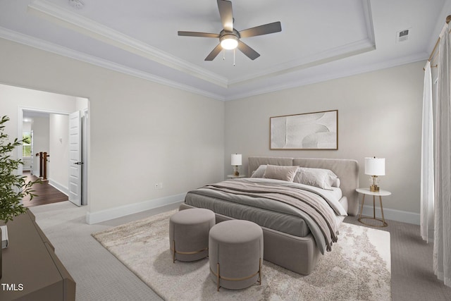 3053 Roy Ct, Apex, NC 27523 - carpeted bedroom featuring a raised ceiling, crown molding, and a ceiling fan