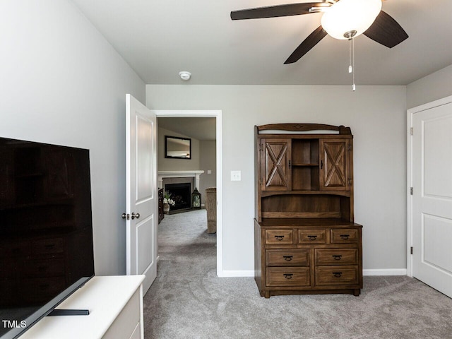 286 Beaver Tavern Dr, Benson, NC 27504 - bedroom with light carpet, a fireplace with flush hearth, a ceiling fan, and baseboards