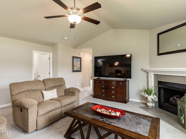 286 Beaver Tavern Dr, Benson, NC 27504 - living room with ceiling fan, vaulted ceiling, carpet floors, baseboards, and a tiled fireplace