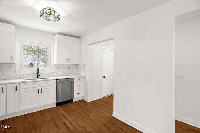 507 Price Ave, Durham, NC 27701 - kitchen with a sink, stainless steel dishwasher, decorative backsplash, light countertops, and dark wood-style flooring