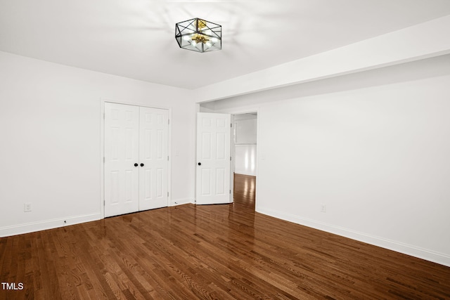 507 Price Ave, Durham, NC 27701 - unfurnished bedroom featuring baseboards and wood finished floors