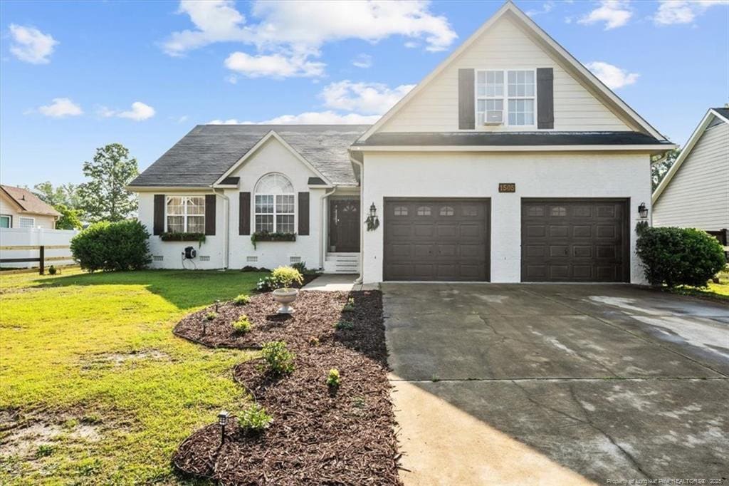 1505 Ridgemont Pl, Fayetteville, NC 28314 - traditional-style home with concrete driveway, stucco siding, and an attached garage
