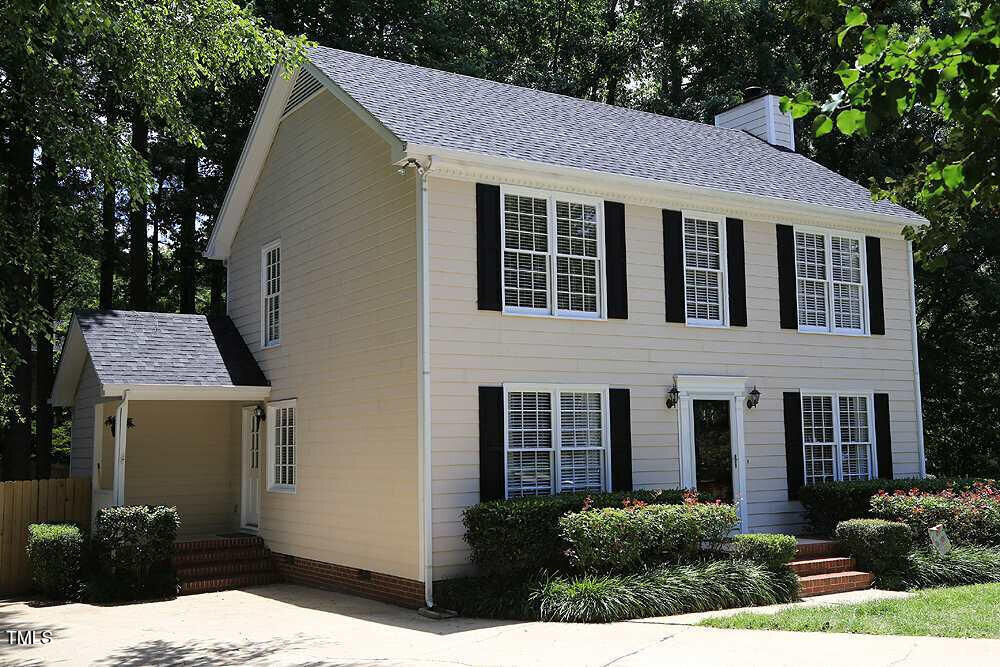 8116 Bentwood Pl, Raleigh, NC 27615 - colonial inspired home featuring a chimney and roof with shingles