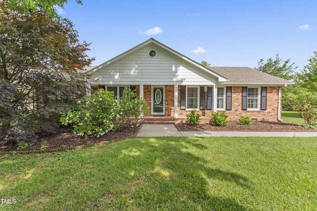 6411 Pondview Ln, Durham, NC 27712 - view of front of home with brick siding, a porch, a front yard, and a shingled roof