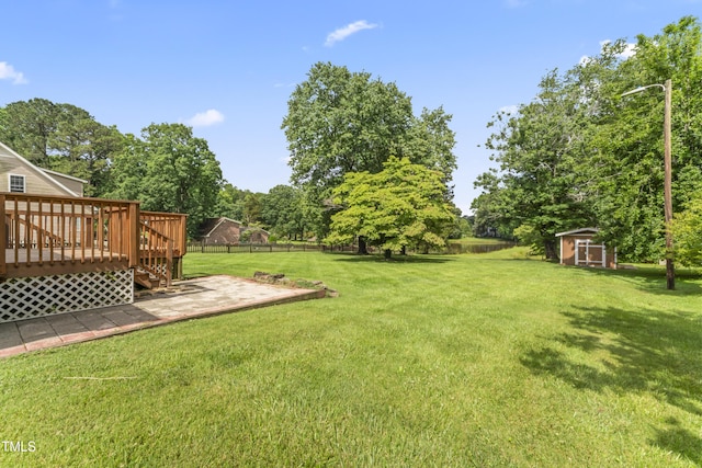 6411 Pondview Ln, Durham, NC 27712 - view of yard with a wooden deck and a patio area