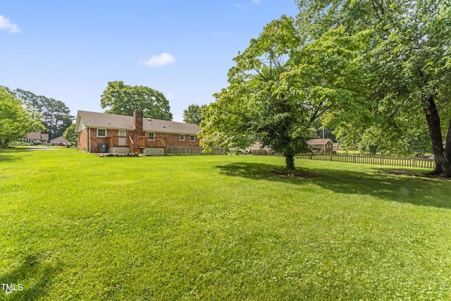 6411 Pondview Ln, Durham, NC 27712 - view of yard with a wooden deck