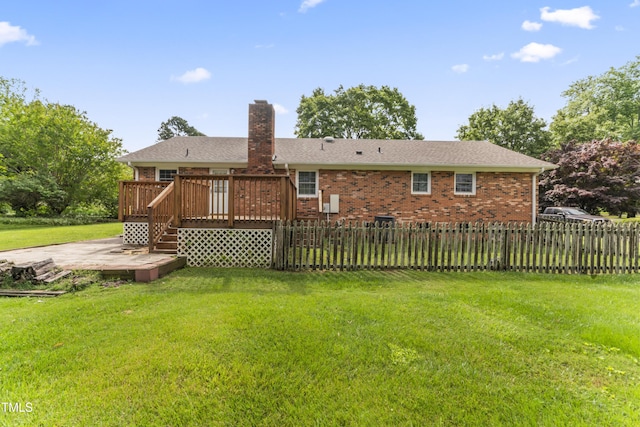 6411 Pondview Ln, Durham, NC 27712 - rear view of property featuring a wooden deck, a chimney, and brick siding