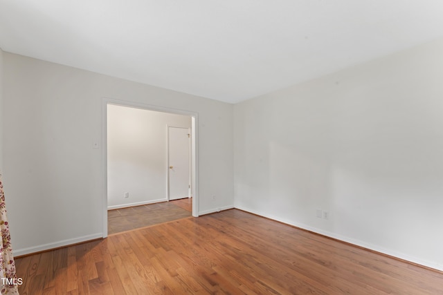 6411 Pondview Ln, Durham, NC 27712 - empty room with wood finished floors and baseboards