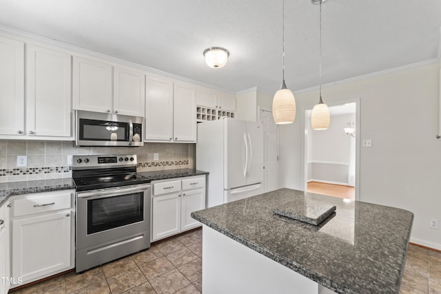 6411 Pondview Ln, Durham, NC 27712 - kitchen featuring stainless steel appliances, decorative backsplash, white cabinetry, ornamental molding, and hanging light fixtures