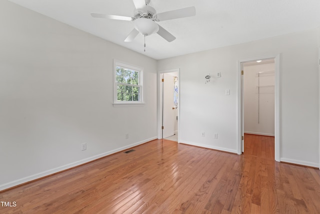 6411 Pondview Ln, Durham, NC 27712 - spare room featuring light wood-type flooring, baseboards, and a ceiling fan