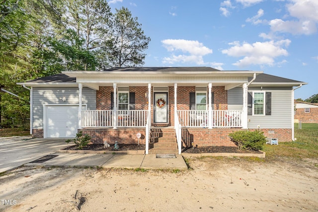 1515 Mack St, Spring Lake, NC 28390 - view of front facade featuring covered porch, a garage, concrete driveway, and brick siding