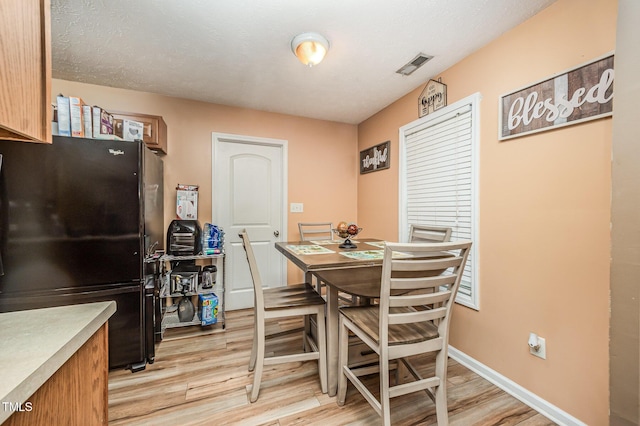1515 Mack St, Spring Lake, NC 28390 - dining space featuring light wood-style floors and baseboards