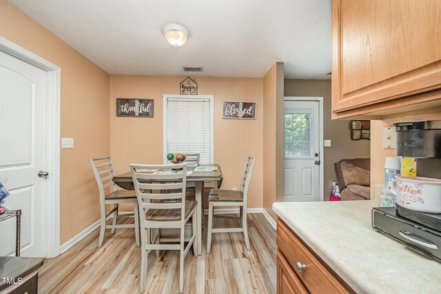 1515 Mack St, Spring Lake, NC 28390 - dining area with light wood-style flooring and baseboards
