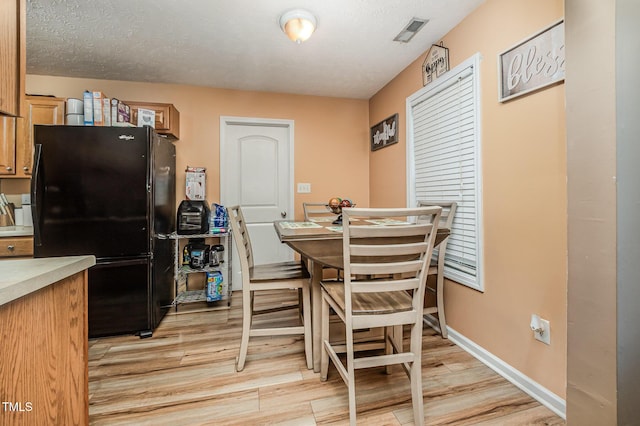 1515 Mack St, Spring Lake, NC 28390 - dining space featuring light wood-style floors and baseboards