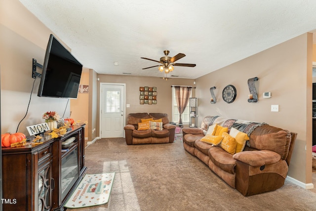 1515 Mack St, Spring Lake, NC 28390 - carpeted living room with a ceiling fan, baseboards, and a textured ceiling
