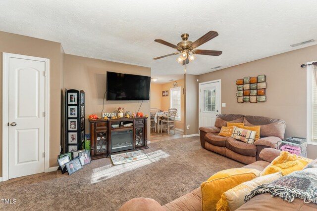 1515 Mack St, Spring Lake, NC 28390 - carpeted living area featuring ceiling fan and baseboards
