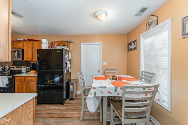 1515 Mack St, Spring Lake, NC 28390 - dining area with light wood finished floors