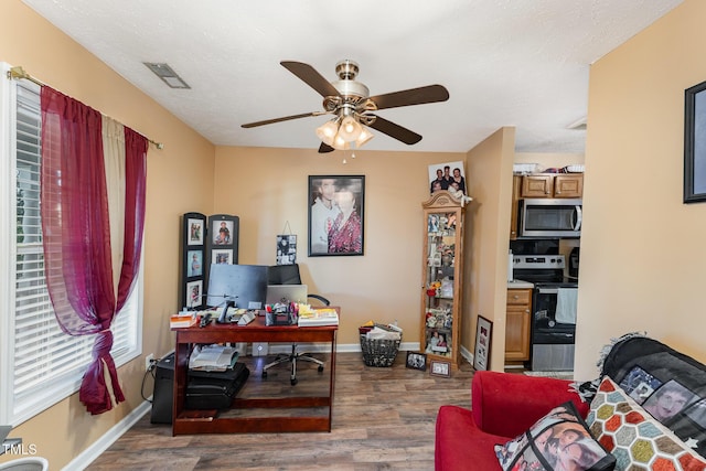 1515 Mack St, Spring Lake, NC 28390 - home office featuring ceiling fan, wood finished floors, and baseboards