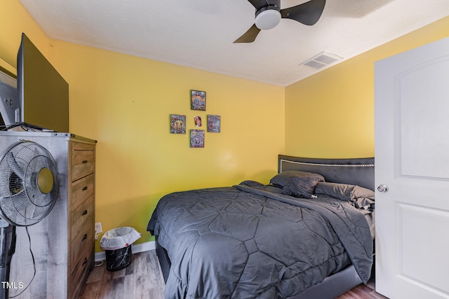 1515 Mack St, Spring Lake, NC 28390 - bedroom featuring wood finished floors, a ceiling fan, and baseboards