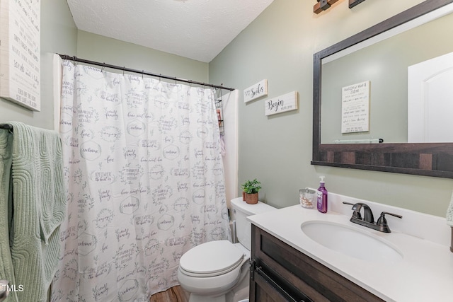 1515 Mack St, Spring Lake, NC 28390 - bathroom featuring toilet, vanity, a textured ceiling, and a shower with curtain