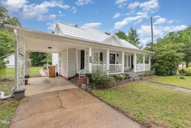 532 N Oneil St, Clayton, NC 27520 - view of front of property with concrete driveway, an attached carport, and a porch