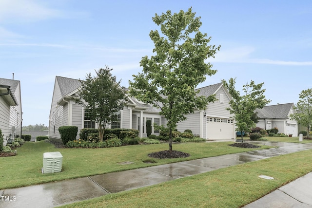 118 Manning Way, Durham, NC 27703 - obstructed view of property featuring a front yard and a garage
