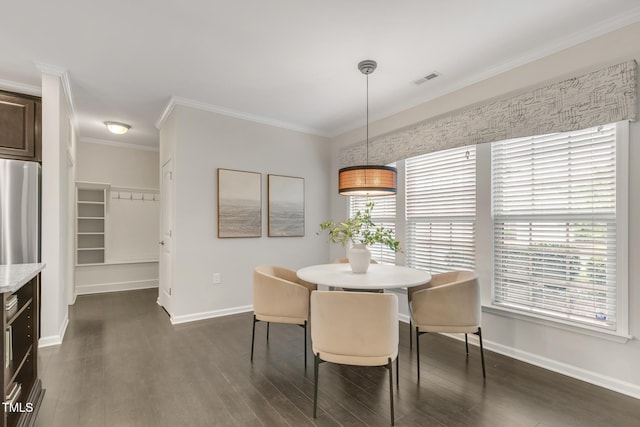 118 Manning Way, Durham, NC 27703 - dining room featuring dark wood-style floors, baseboards, and crown molding
