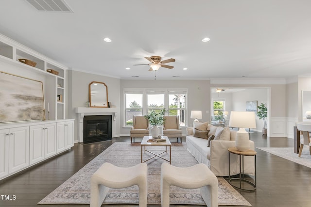 118 Manning Way, Durham, NC 27703 - living room featuring ceiling fan, dark wood-style flooring, ornamental molding, recessed lighting, and a fireplace with flush hearth
