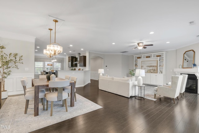 118 Manning Way, Durham, NC 27703 - dining space featuring ornamental molding, recessed lighting, dark wood finished floors, arched walkways, and ceiling fan