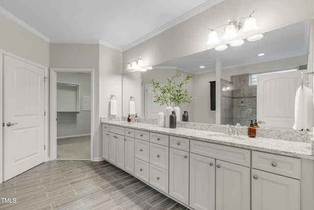118 Manning Way, Durham, NC 27703 - bathroom featuring double vanity, a walk in shower, ornamental molding, wood finished floors, and baseboards