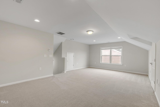 118 Manning Way, Durham, NC 27703 - additional living space featuring light carpet, vaulted ceiling, baseboards, and recessed lighting