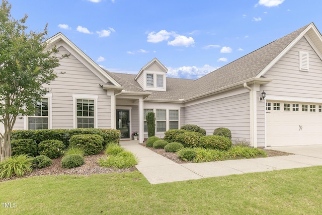 118 Manning Way, Durham, NC 27703 - view of front of house featuring roof with shingles, a front lawn, concrete driveway, and a garage